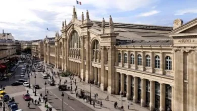 Paris Gare du Nord concourse with departure boards and travelers